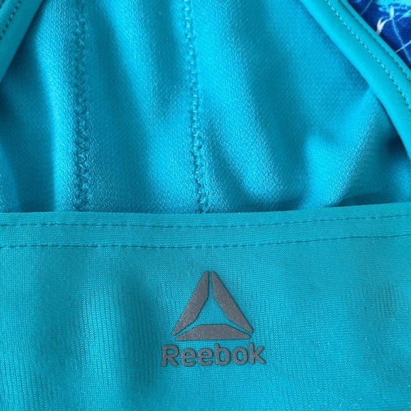 Reebok Woman's Sports Bra Size in Photos Blue Marble
High Neck Feminine Sporty - Picture 4 of 7